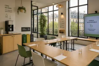 Eco-friendly event space in Paris with large windows, minimalist reusable furniture, filtered water station, waste-sorting signage, and views of Parisian architecture outside.